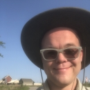 FWS Park Ranger in hat smiling for the camera