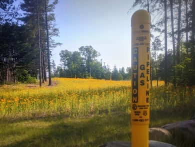 A gas pipeline maker with pollinator habitat along a right-of-way